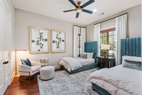 a bedroom with two beds and a window