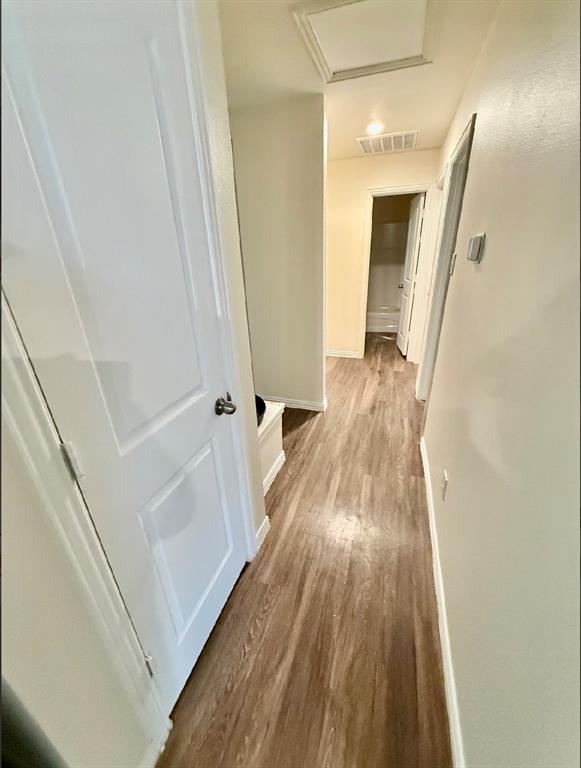 812 South 22nd Street Temple, TX 76501 - Photo 17 of 34 a view of a hallway with wooden floor and staircase