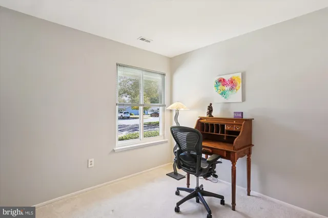 a bathroom with a sink toilet vanity and shower