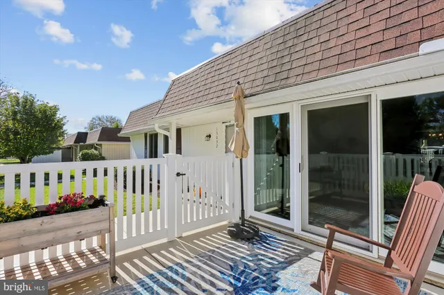 a picture of a bench in front of a wall