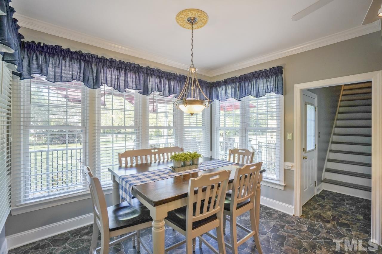 1505 Habbot Drive Raleigh, NC 27603 - Photo 16 of 32 a view of a dining room with furniture window and wooden floor