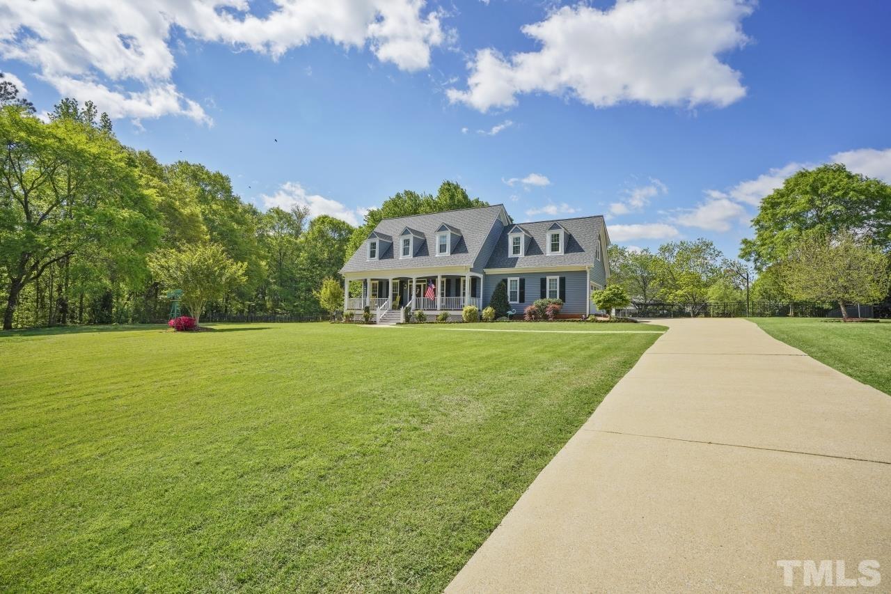 1505 Habbot Drive Raleigh, NC 27603 - Photo 2 of 32 a view of a house with a big yard