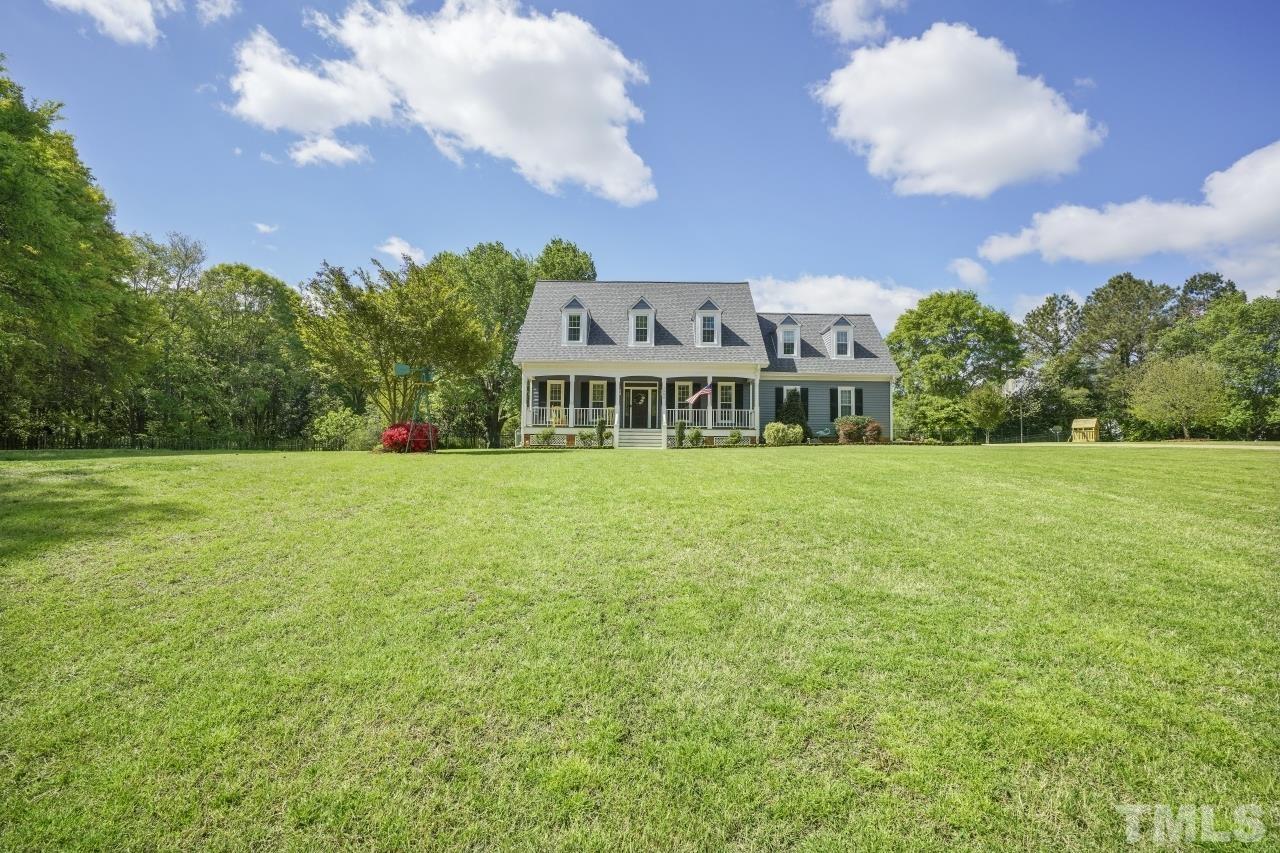 1505 Habbot Drive Raleigh, NC 27603 - Photo 29 of 32 a view of a big yard with a building in the background