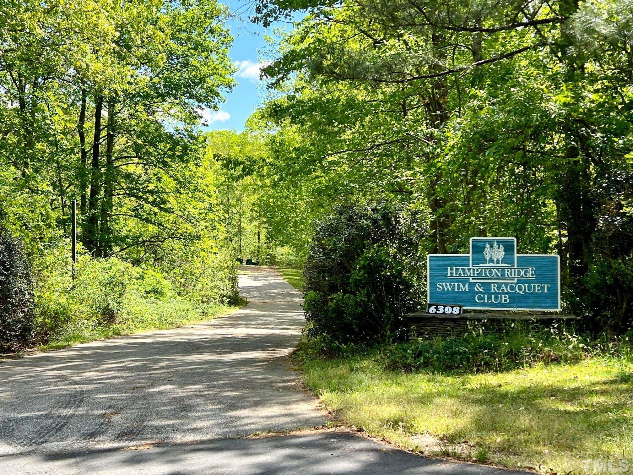 1505 Habbot Drive Raleigh, NC 27603 - Photo 31 of 32 a front view of a house with a yard and trees