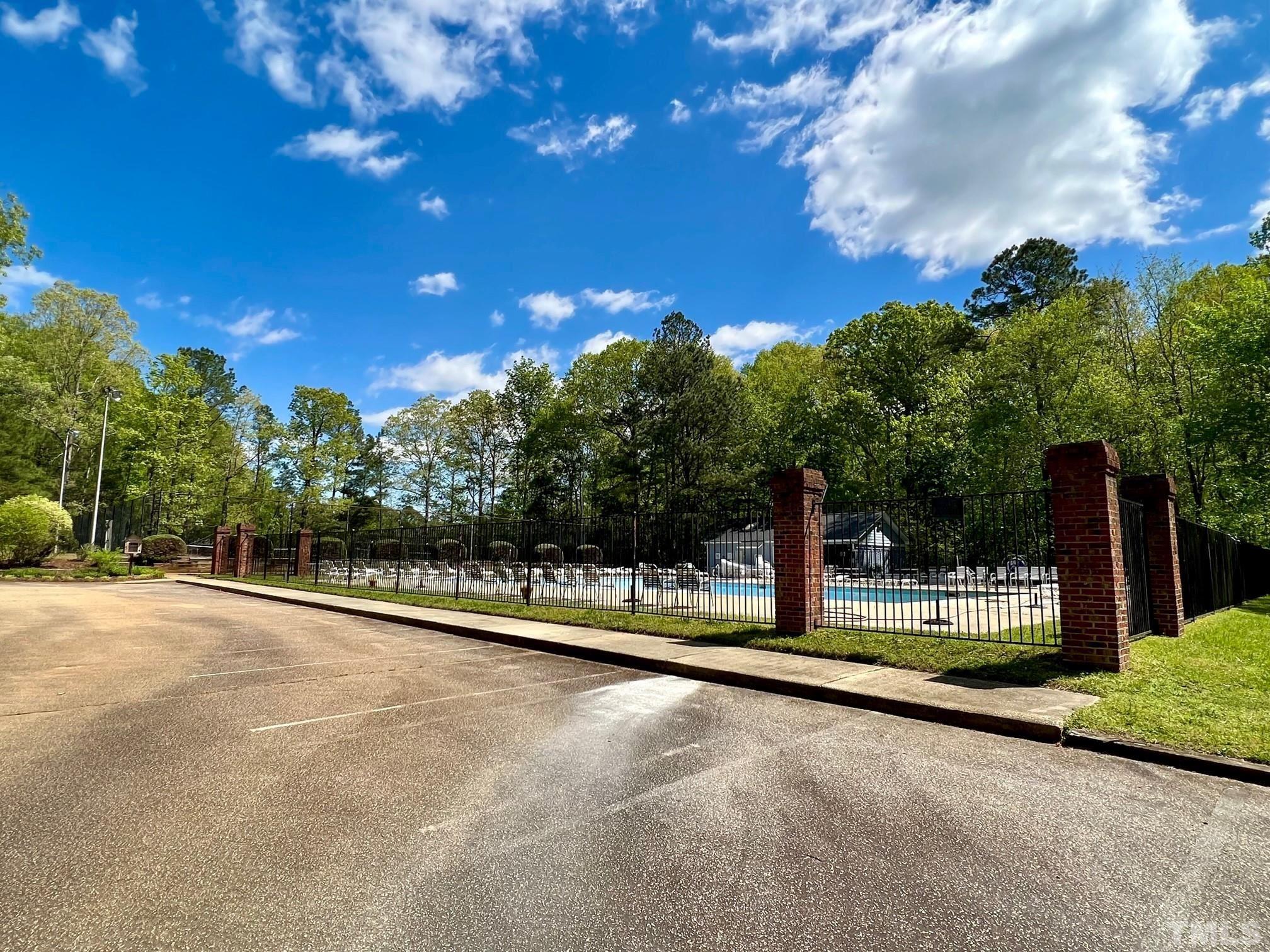 1505 Habbot Drive Raleigh, NC 27603 - Photo 32 of 32 a view of a swimming pool with an outdoor space and seating area