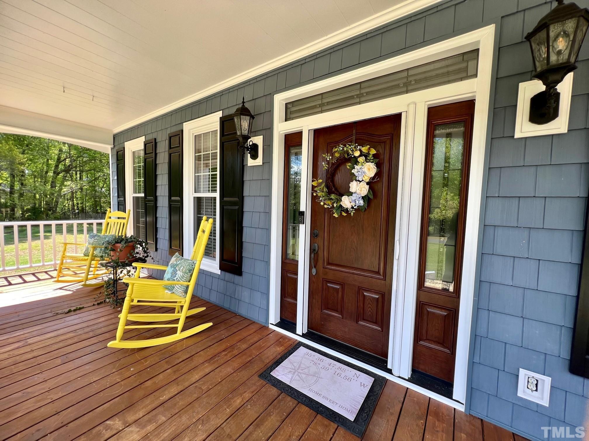 1505 Habbot Drive Raleigh, NC 27603 - Photo 6 of 32 a wooden bench sitting in front of a building