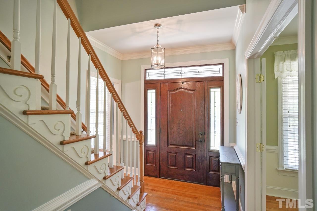 1505 Habbot Drive Raleigh, NC 27603 - Photo 7 of 32 a view of entryway and hall with wooden floor
