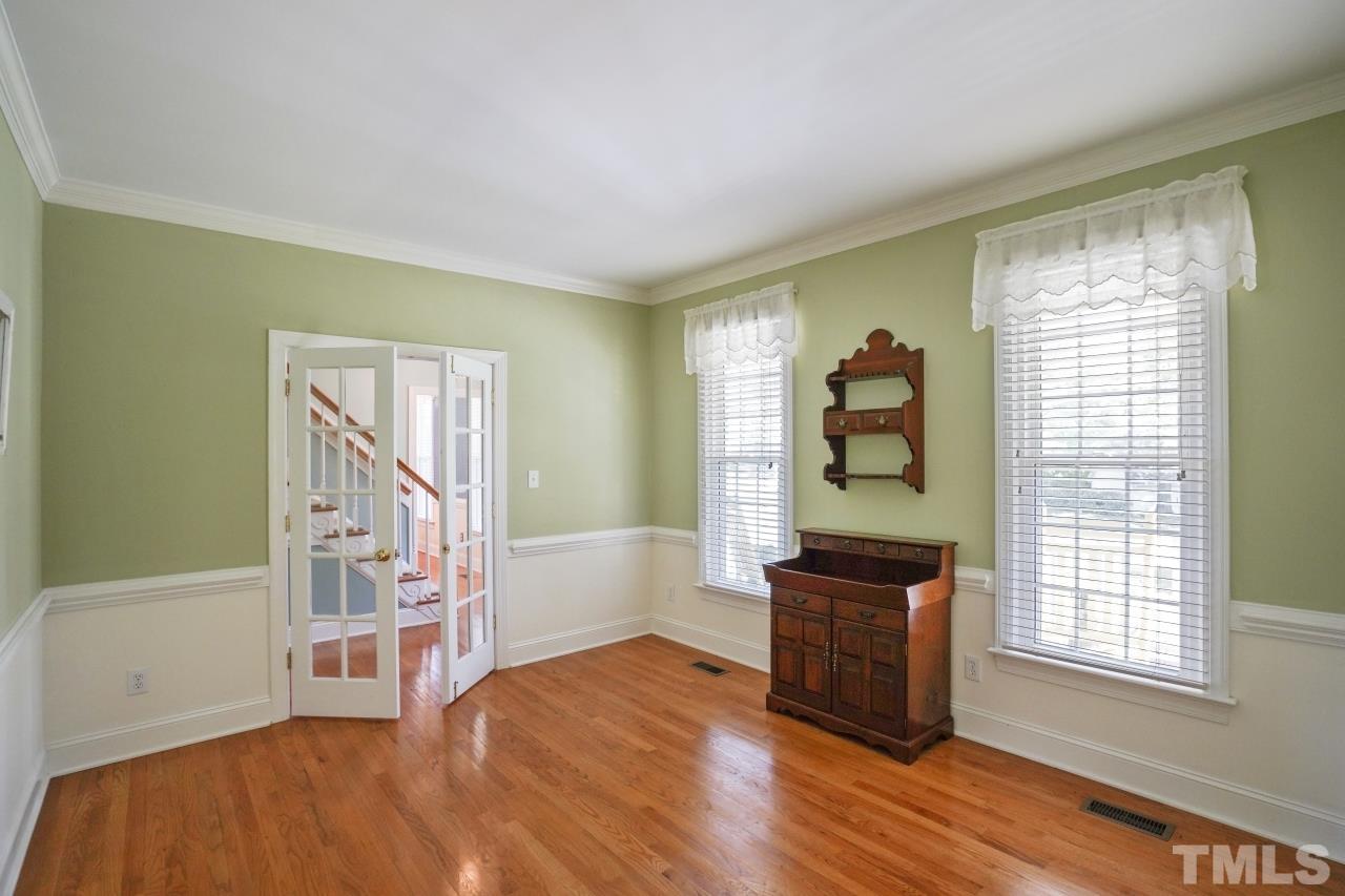 1505 Habbot Drive Raleigh, NC 27603 - Photo 8 of 32 a living room with furniture and a window