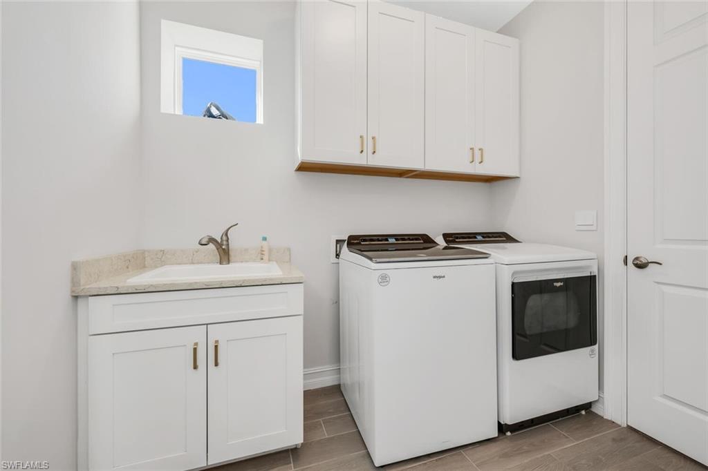 28041 Captiva Shell Loop Bonita Springs, FL 34135 - Photo 10 of 24 a utility room with dryer and washer