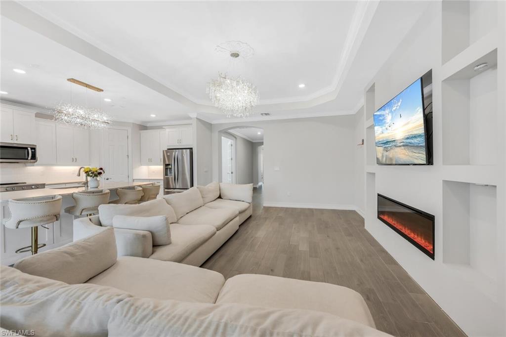 28041 Captiva Shell Loop Bonita Springs, FL 34135 - Photo 4 of 24 a living room with furniture and a flat screen tv