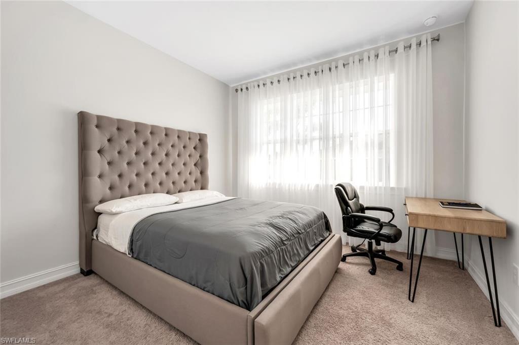 28041 Captiva Shell Loop Bonita Springs, FL 34135 - Photo 8 of 24 a bedroom with a bed chair and a window