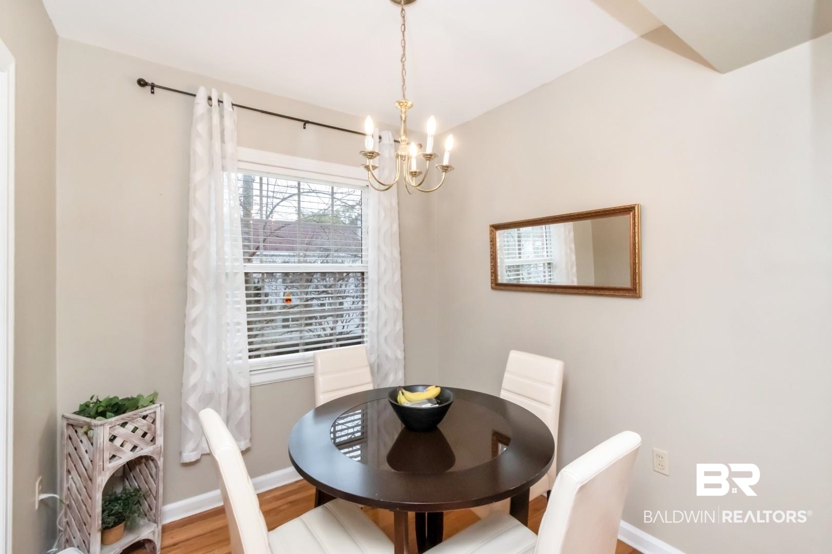 214 Upham Street, Unit 17C Mobile, AL 36607 - Photo 18 of 32 Dining room featuring wood finished floors and suspended lighting