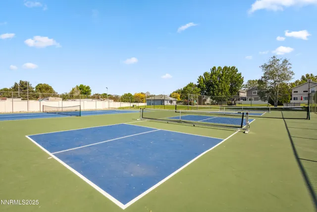 a view of an outdoor space and tennis court