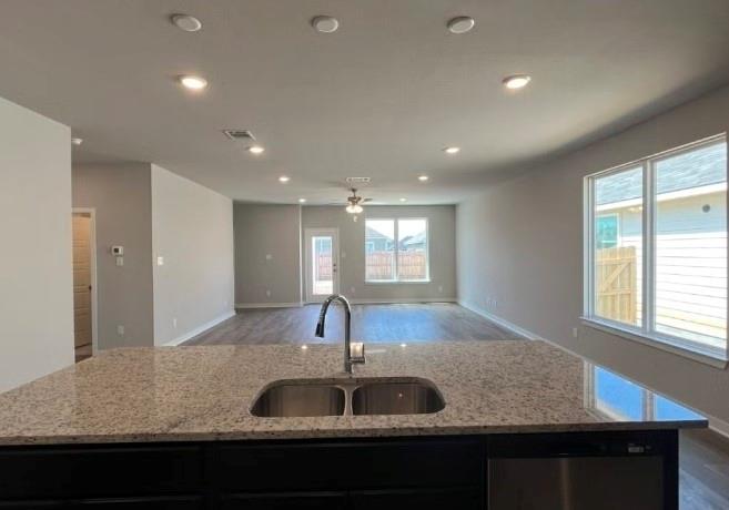 4065 Rimfire Road Waco, TX 76705 - Photo 3 of 4 a view of kitchen island a sink and a window