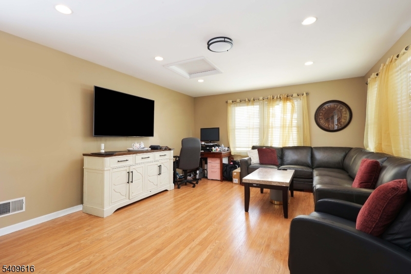 1841 Cider Mill Road Union, NJ 07083 - Photo 16 of 36 a living room with furniture and a flat screen tv