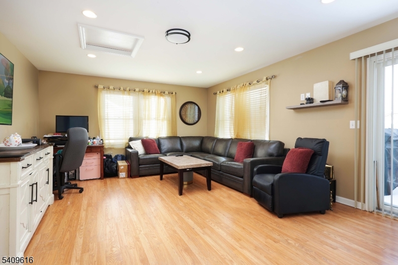 1841 Cider Mill Road Union, NJ 07083 - Photo 17 of 36 a living room with furniture and wooden floor