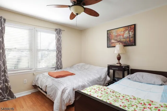 a bathroom with a sink toilet and window