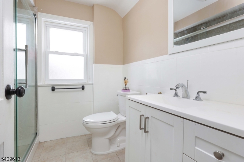 1841 Cider Mill Road Union, NJ 07083 - Photo 21 of 36 a bathroom with a sink toilet and window