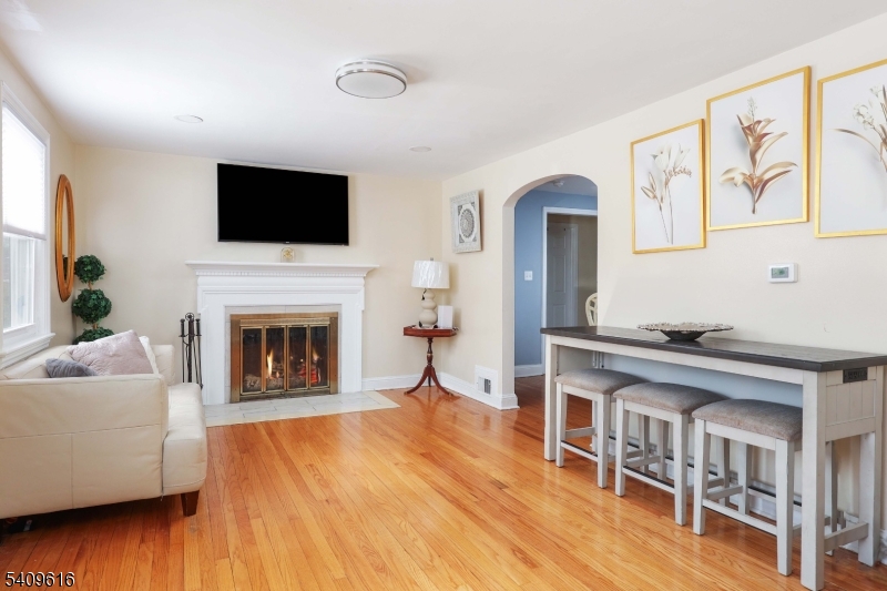 1841 Cider Mill Road Union, NJ 07083 - Photo 5 of 36 a living room with furniture fireplace and flat screen tv