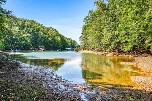 a view of a lake with a yard