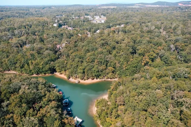 an aerial view of mountain with lake view