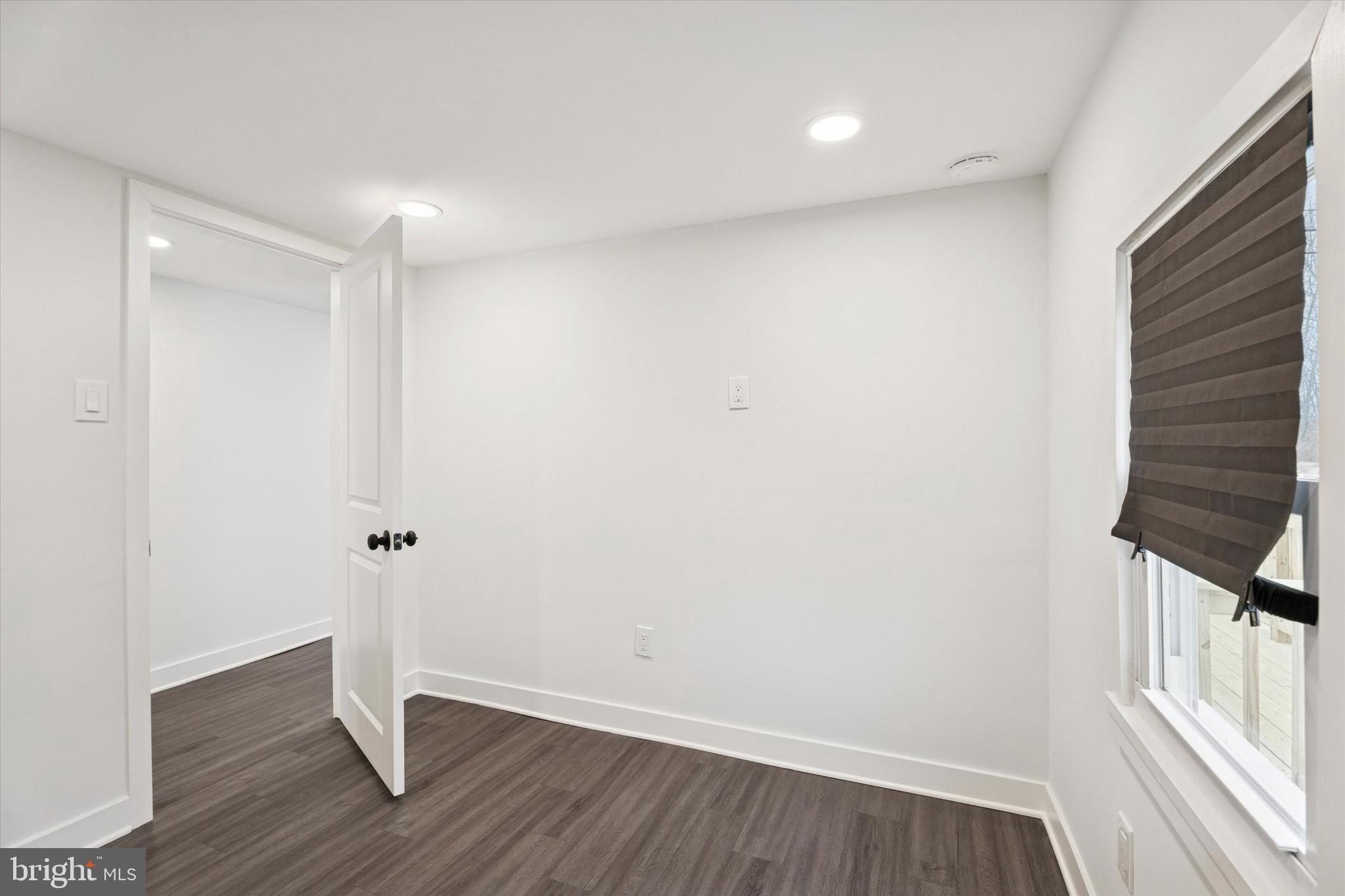 841 Cypress Ave Spring Spring City, PA 19475 - Photo 12 of 15 a view of an empty room with wooden floor and a window