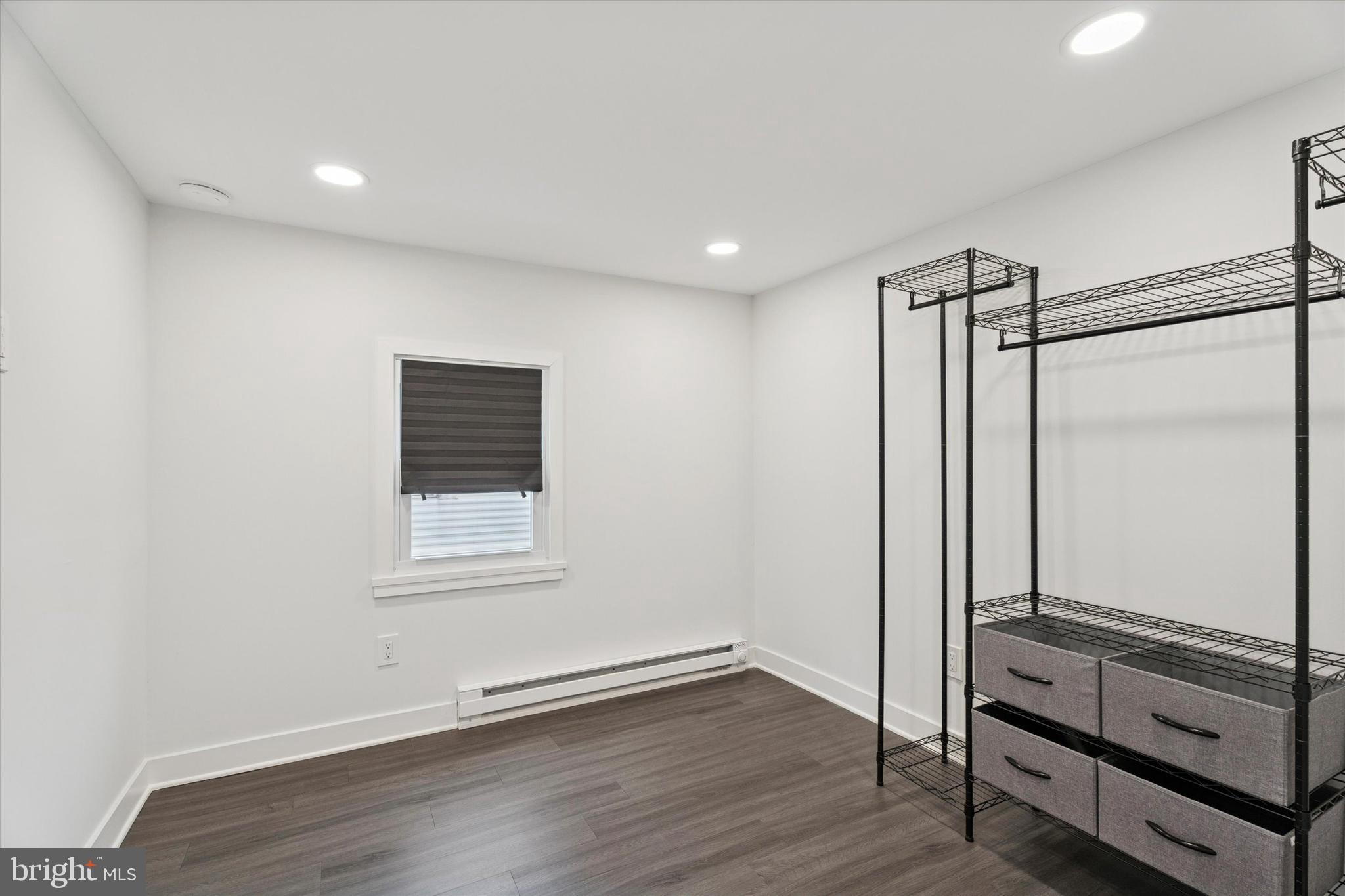 841 Cypress Ave Spring Spring City, PA 19475 - Photo 13 of 15 a view of an empty room with wooden floor and a window