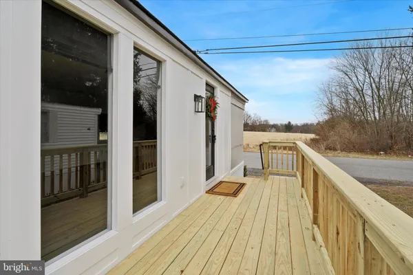 a balcony with wooden floor