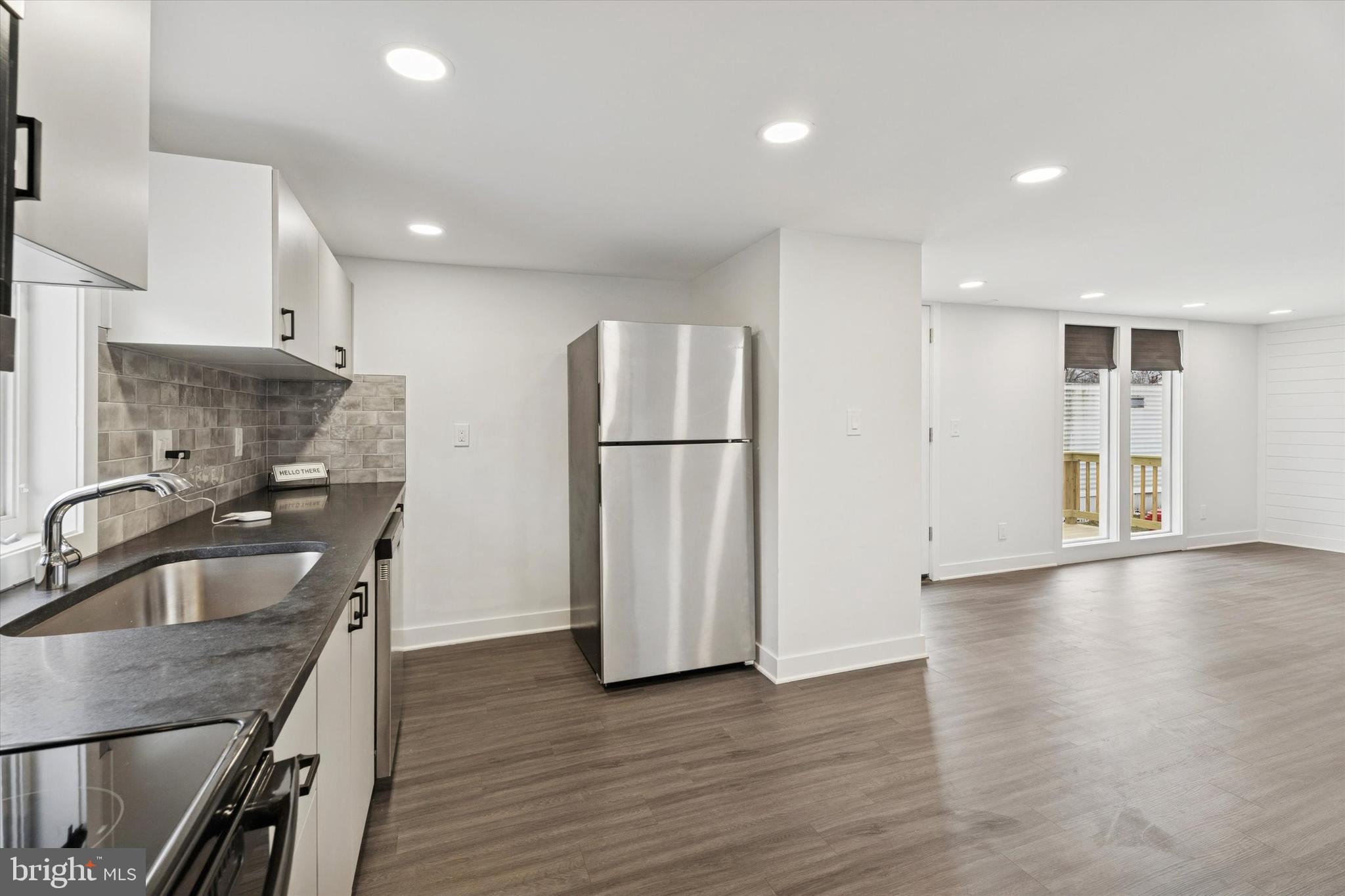 841 Cypress Ave Spring Spring City, PA 19475 - Photo 2 of 15 a kitchen with stainless steel appliances granite countertop a refrigerator a sink and a stove