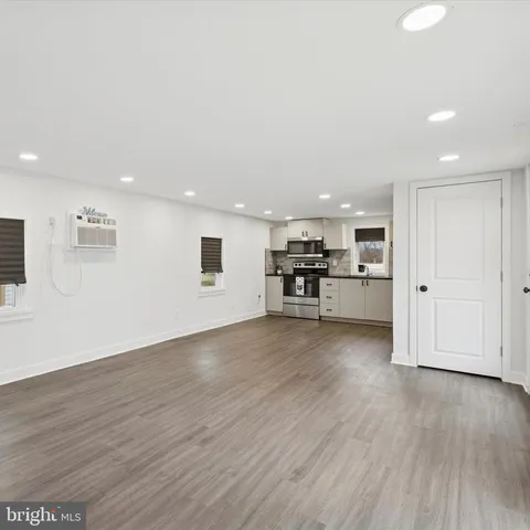 a view of a kitchen with a sink and a stove top oven