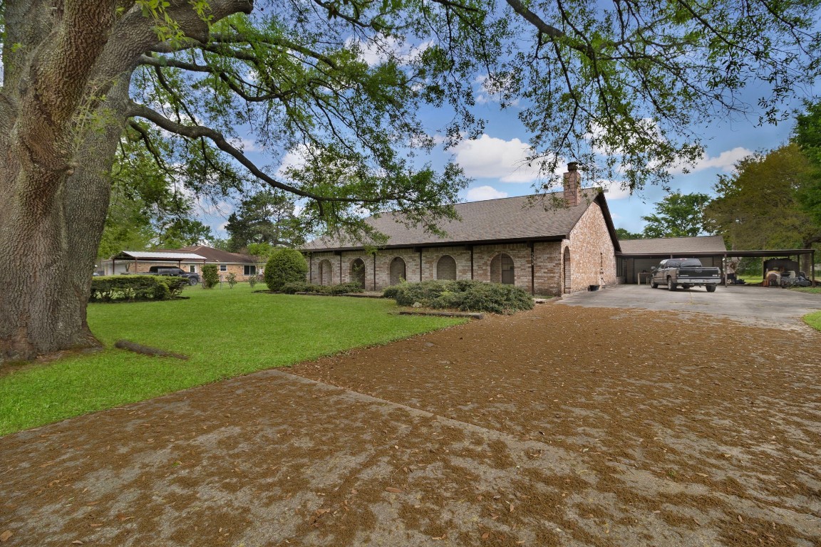 5534 Avanak Street Spring, TX 77389 - Photo 3 of 13 Large driveways, spacious carports, garage space with an unfinished half bath in the garage.