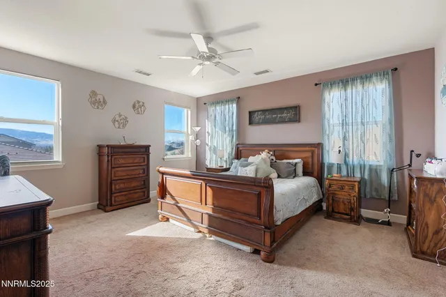 a bed room with a bed and a chandelier