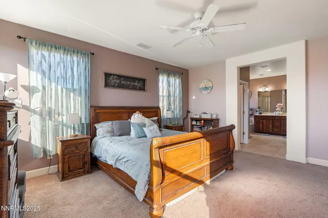 a spacious bathroom with a double vanity sink a mirror and a bathtub