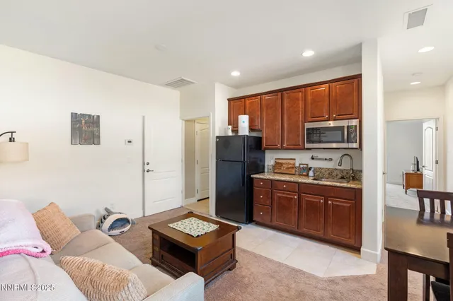 a bathroom with a sink toilet vanity and shower