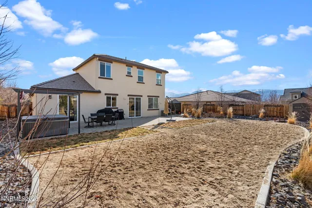a dinning table and chairs in the patio