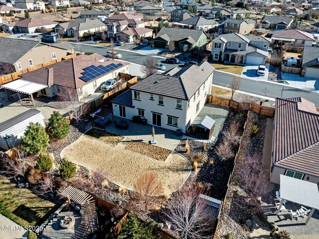 an aerial view of residential houses with outdoor space