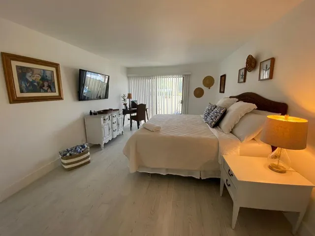 a bedroom with a bed and a couch