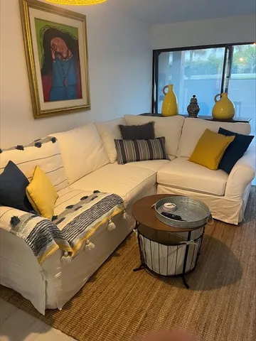 a living room with a couch and a table