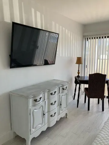 a view of cabinets and chair in a room