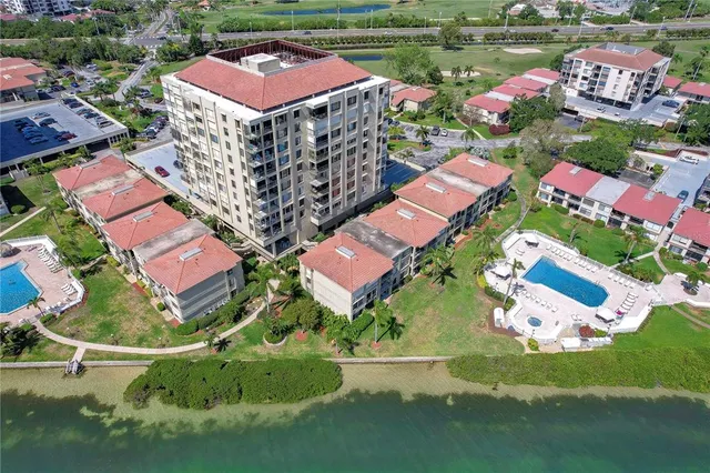an aerial view of a house with a lake view