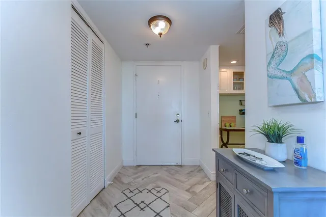 a view of bathroom with a potted plant on a sink and a mirror