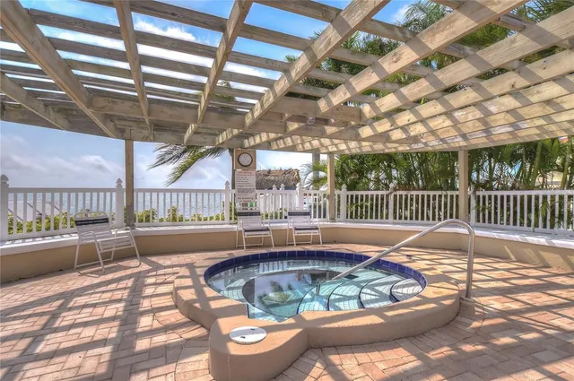 a view of a patio with a patio table and chairs