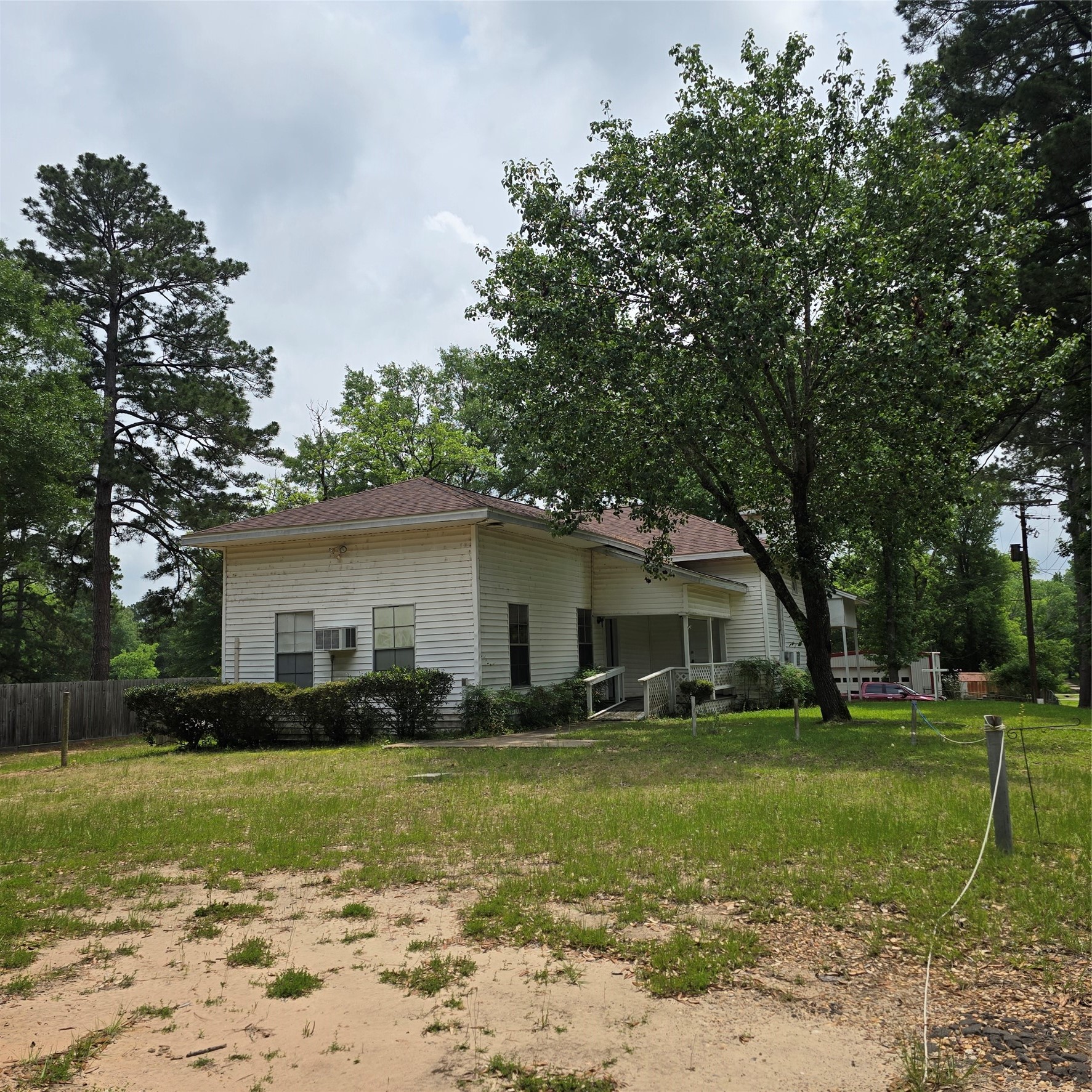 142 Rowe Lane Moscow, TX 75960 - Photo 3 of 16 a front view of house with yard and green space