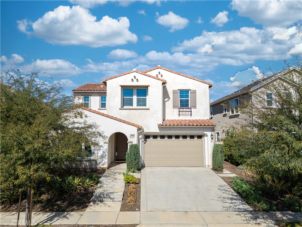 5166 Pomona Rincon Road Chino Hills, CA 91709 - Photo 1 of 1 a front view of a house with a yard