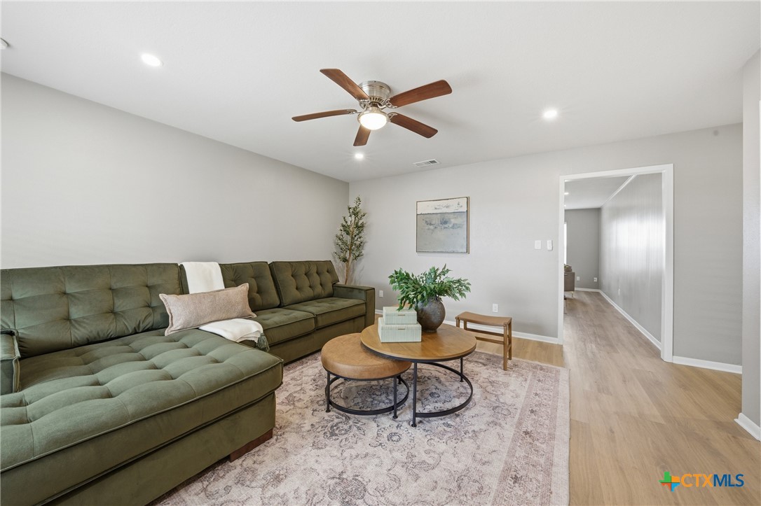6950 Stallion Road Temple, TX 76501 - Photo 20 of 41 a living room with furniture and a ceiling fan