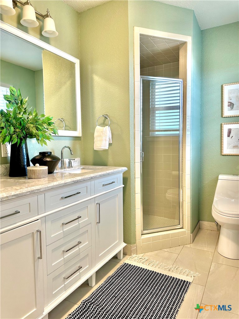6950 Stallion Road Temple, TX 76501 - Photo 25 of 41 a bathroom with a sink a mirror and a toilet