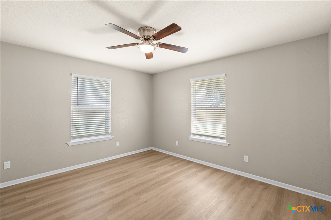 6950 Stallion Road Temple, TX 76501 - Photo 28 of 41 wooden floor in an empty room with a window