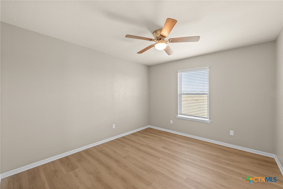 6950 Stallion Road Temple, TX 76501 - Photo 30 of 41 wooden floor in an empty room with a window