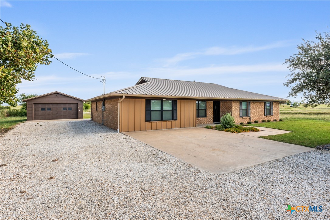 6950 Stallion Road Temple, TX 76501 - Photo 4 of 41 a front view of a house with a yard and garage