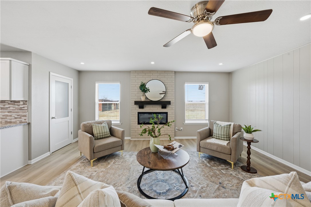 6950 Stallion Road Temple, TX 76501 - Photo 9 of 41 a living room with furniture and a chandelier